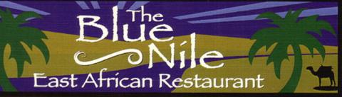 The Blue Nile logo,  two green palm trees against yellow sand dunes with a blue river running through them under a blue sky with a silhouette of a camel in the bottom corner, text reads "The Blue Nile East African Restaurant"